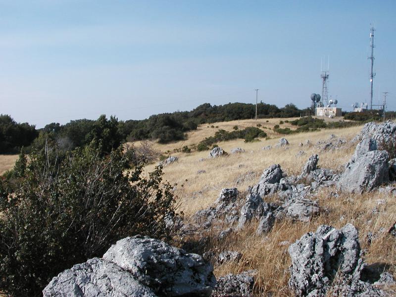 A big cluster of ugly cell towers adorns the summit to the east