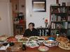 My grandmother in front of a table of food
