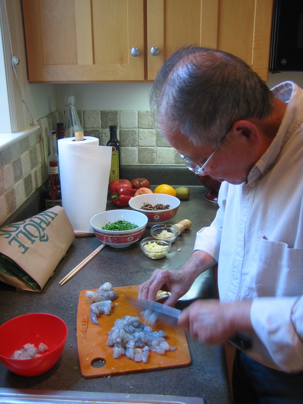 Dad chopping shrimp.