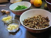 Chopped vegetable ingredients: ginger, garlic, Chinese chives, mushrooms.