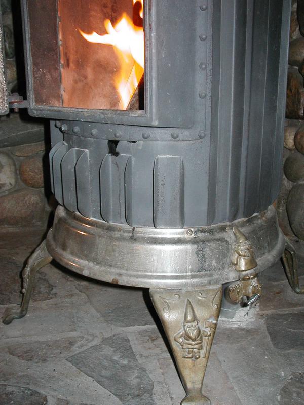 The damper is on the lower right of the stove. Note that the stove is held up by gnomes.