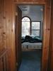 The master bedroom upstairs, which has a king bed and a double, has a beautiful window that looks out into the forest